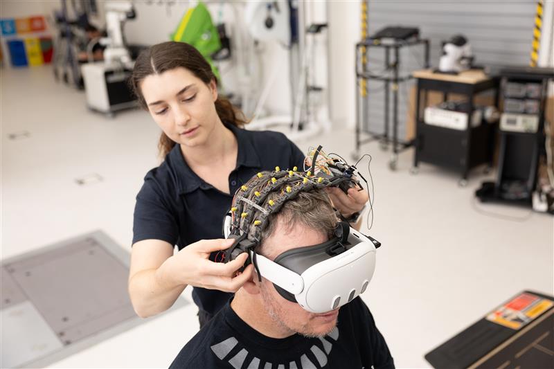 Person adjusting a VR headset