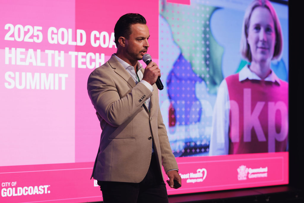 Director of GCHKP presenting on stage