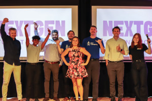 All seven student and researcher-led startup teams gather on stage for a group photo at the end of the 2025 NextGen Pre-Accelerator Demo Night.