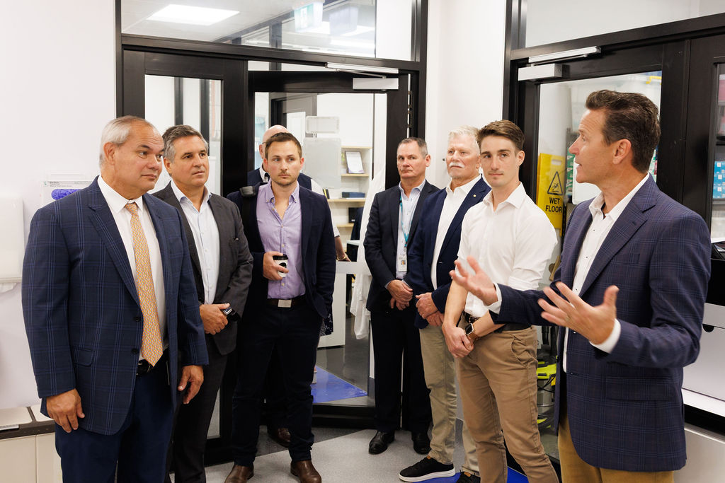Southern RNA CEO Chris Peck speaks with Gold Coast Mayor Tom Tate, GCHKP Director Craig Rowsell, and partners during a lab tour at the Gold Coast Health and Knowledge Precinct, highlighting the city’s growing leadership in mRNA research and biotech innovation.