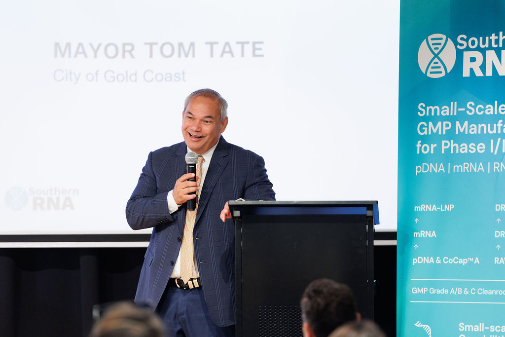 Mayor Tom Tate speaks at the podium during the launch event at Cohort Innovation Space.