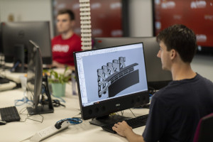 Engineer working on a computer designing a prototype model in a lab environment at Griffith University ADaPT Institute