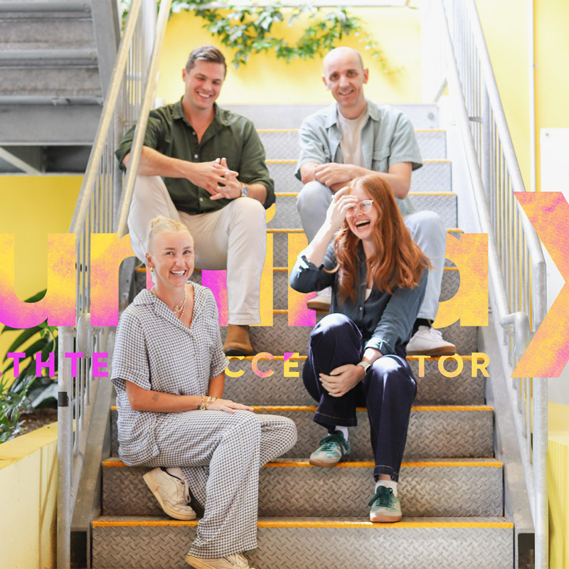 Team from the LuminaX HealthTech Accelerator 2026 cohort sitting on stairs at Cohort Innovation Space with branding overlay