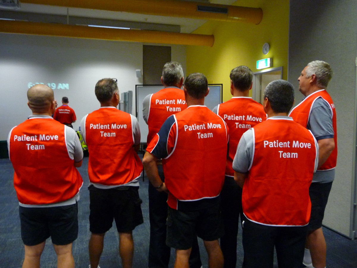 Members of the Patient Move Team gather for a final briefing before relocating patients to Gold Coast University Hospital in September 2013.