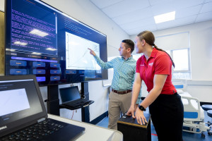 Students using digital health technology in a teaching laboratory.