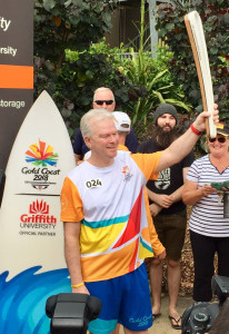 Emeritus Professor Mark von Itzstein AO carries the Queen's Baton through Griffith University's Gold Coast campus during the Gold Coast 2018 Commonwealth Games Queen's Baton Relay as an official Griffith representative.